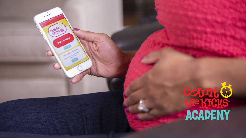 An expectant mom uses the Count the Kicks app to track her baby's movement.