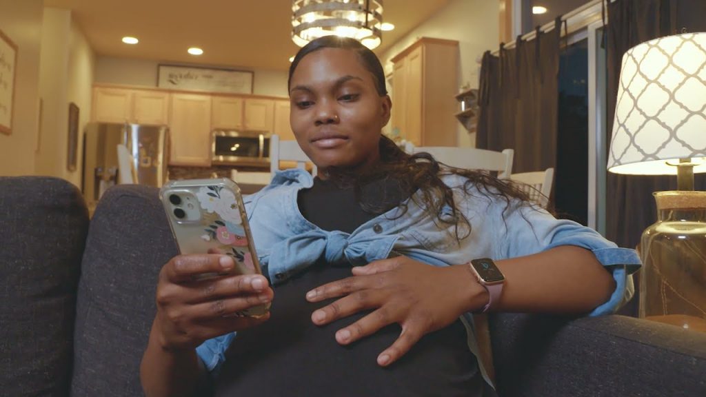 Expectant woman uses Count the Kicks app.