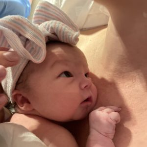 Newborn Cathryn rests on her mom's chest