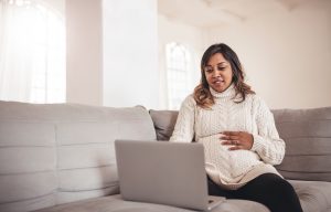 A pregnant mom counts her baby's kicks on the web-counting platform.